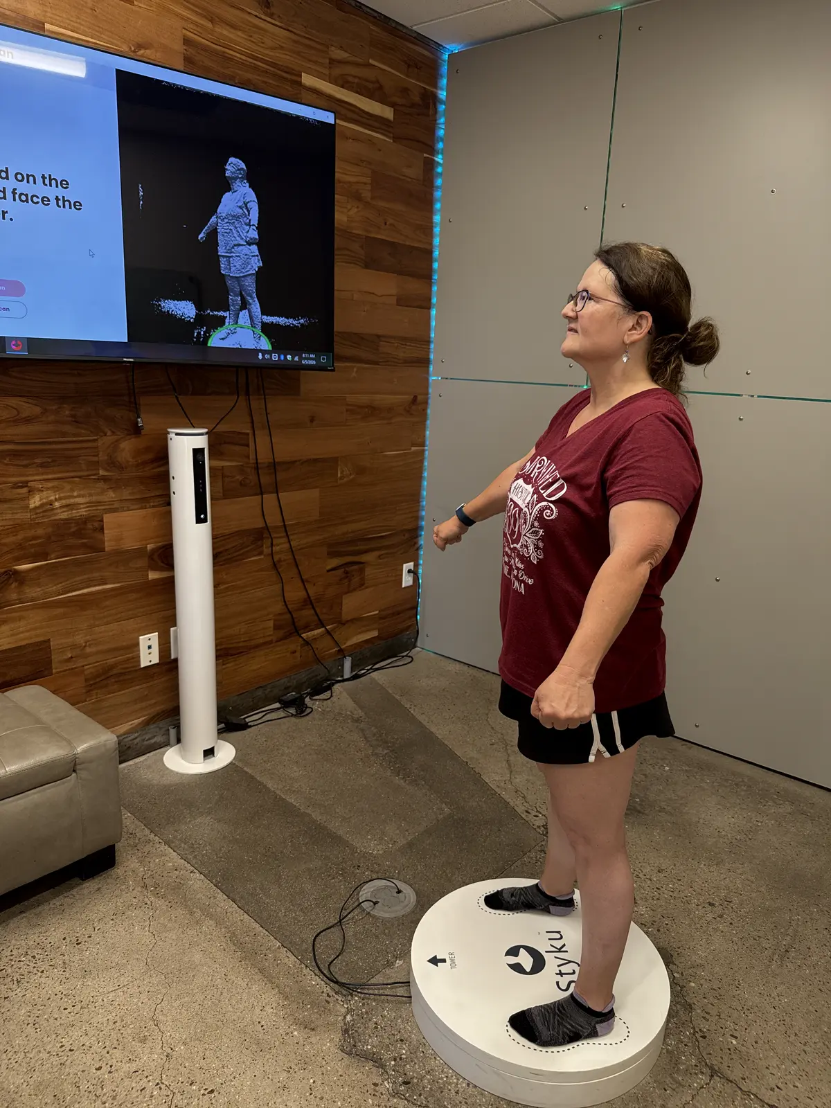 A Prestige Fitness client completing a Styku 3D body scan